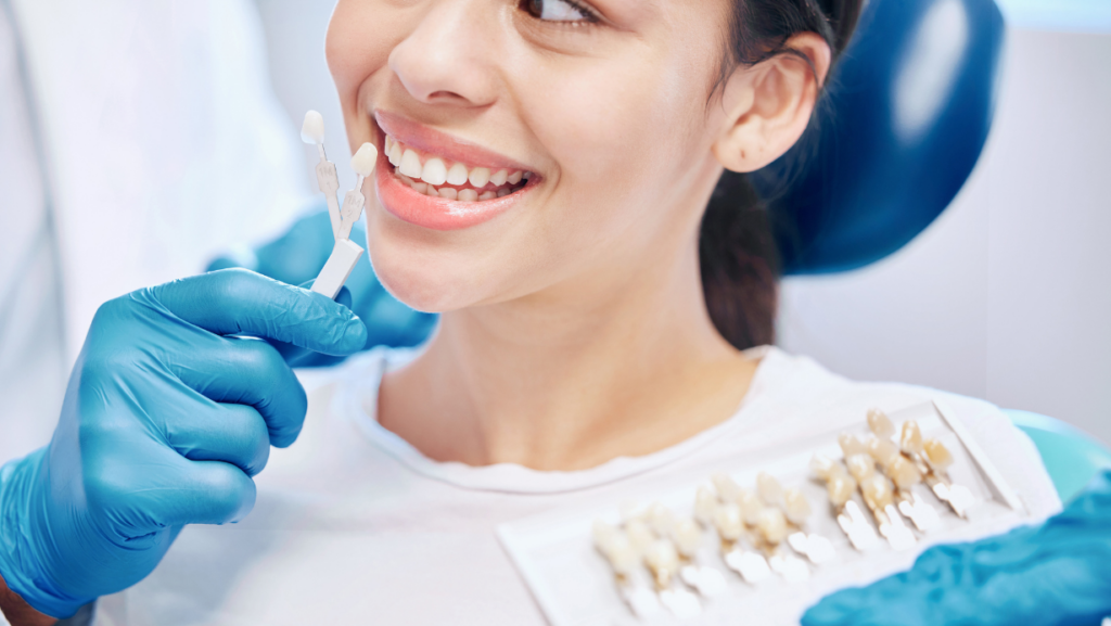 woman at dentist exploring porcelain veneers FAQ Greenwood IN